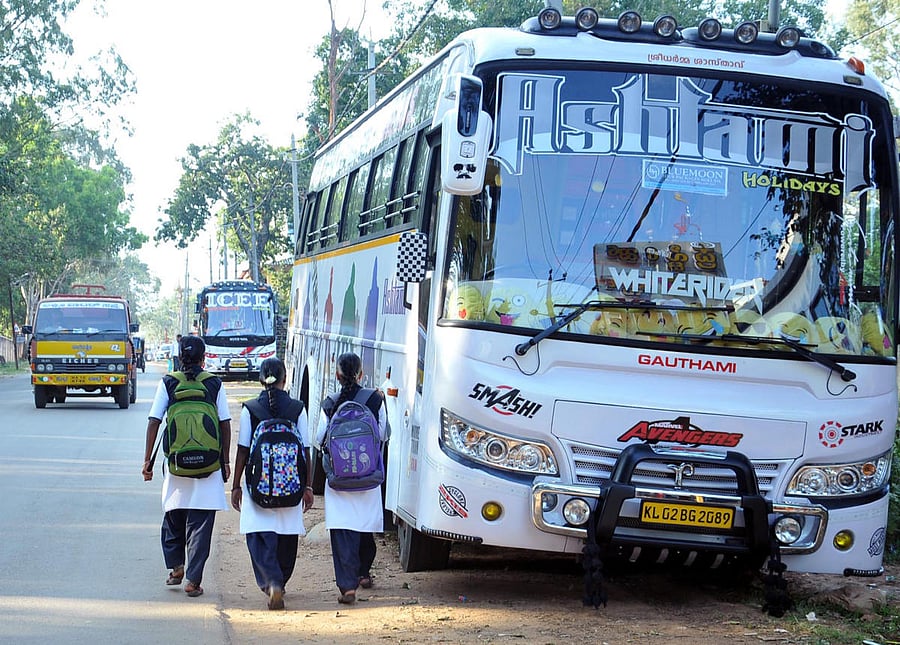 Students are forced to walk on the road as tourist vehicles are parked on the roadside in Chikkamagaluru.