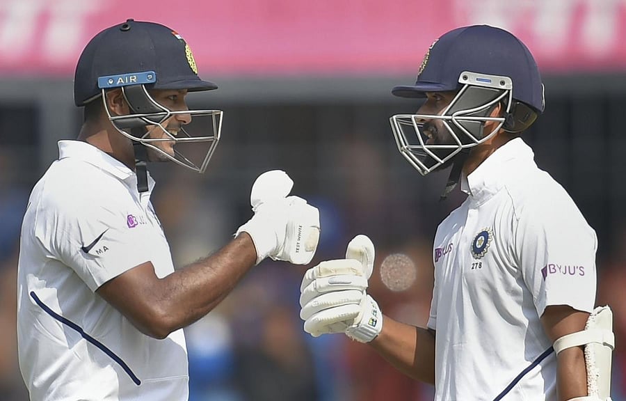 Indian batsman Mayank Agarwal (L) celebrates his century with teammate Ajinkya Rahane on the second day the first cricket test match against Bangladesh, in Indore, Friday, Nov 15, 2019. (PTI Photo/Kamal Kishore)