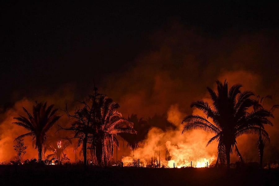 View of fire from the BR163 highway, near Itaituba, Para state, Brazil, in the Amazon rainforest, on September 10, 2019. - The BR230 and BR163 are major transport routes in Brazil that have played a key role in the development and destruction of the world