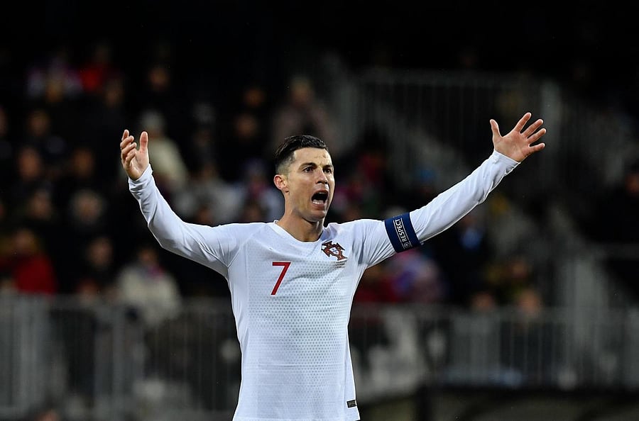 Portugal's forward Cristiano Ronaldo celebrates after scoring a goal during the UEFA Euro 2020 Group B qualification football match between Luxembourg and Portugal at the Josy Barthel Stadium in Luxembourg on November 17, 2019. (Photo by AFP)