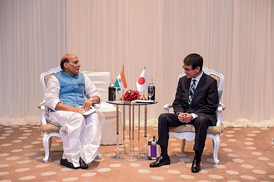 India's Defence Minister Rajnath Singh (L) talks with Japan's Defence Minister Taro Kono on the sidelines of ASEAN Defence Ministers' Meeting, ADMM-Plus, in Bangkok. (AFP Photo)