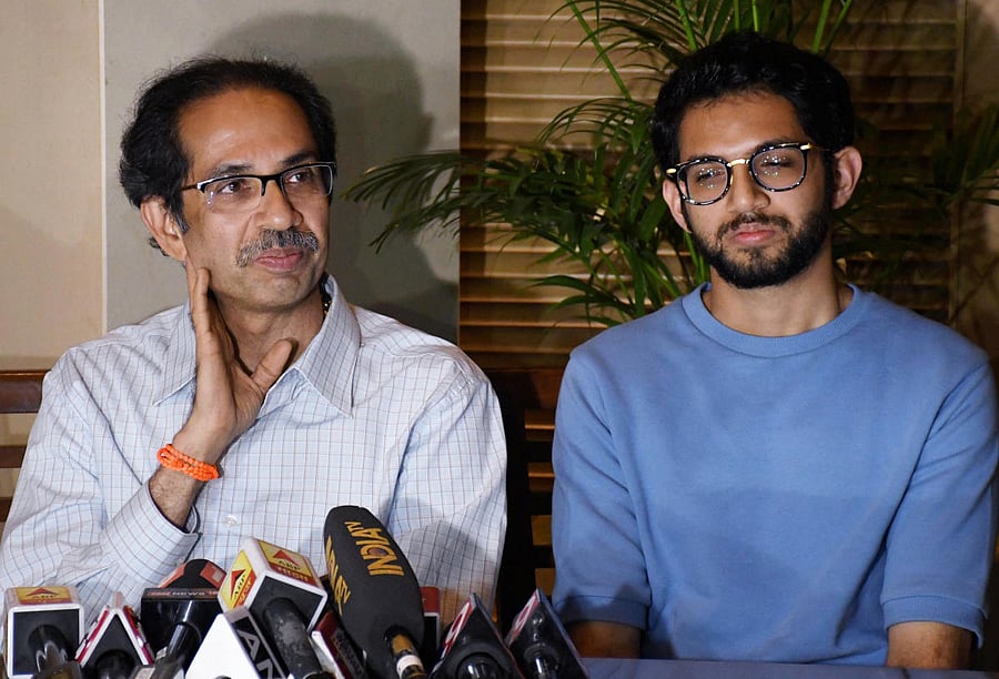 Shiv Sena chief Uddhav Thackeray with his son and Yuva Sena chief Aaditya Thackeray. (Photo by PTI)