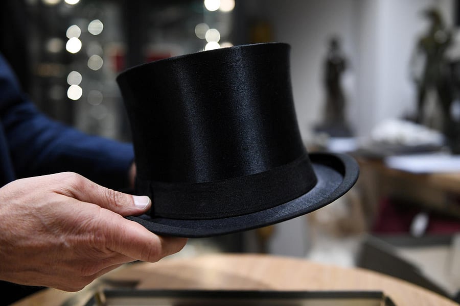 A man holds the cylinder hat of German Nazi leader Adolf Hitler at the auction house Hermann Historica in Munich (Reuters photo)