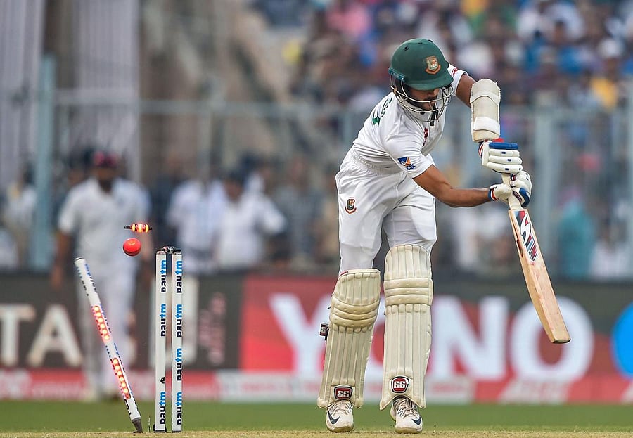 Bangladesh's Nayeem Hasan's off-stump is knocked off by Indian paceman Ishant Sharma on the opening day of the pink ball Test at the Eden Gardens on Friday. PTI