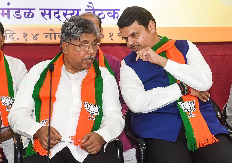 Maharashtra BJP President Chandrakant Patil with former chief minister Devendra Fadnavis during the party MLAs meeting at the BJP office in Mumbai. (PTI Photo)