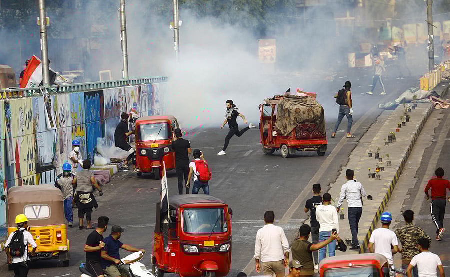 Iraqi demonstrators use tuk-tuk during ongoing anti-government protests in Baghdad, Iraq. (Reuters Photo)