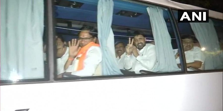 The MLAs travelled in a bus to a different hotel from Hotel Renaissance in Powai where they were put up since Saturday night, hours after NCP leader Ajit Pawar joined hands with the BJP in a coup and took oath as deputy chief minister. Photo/ANI