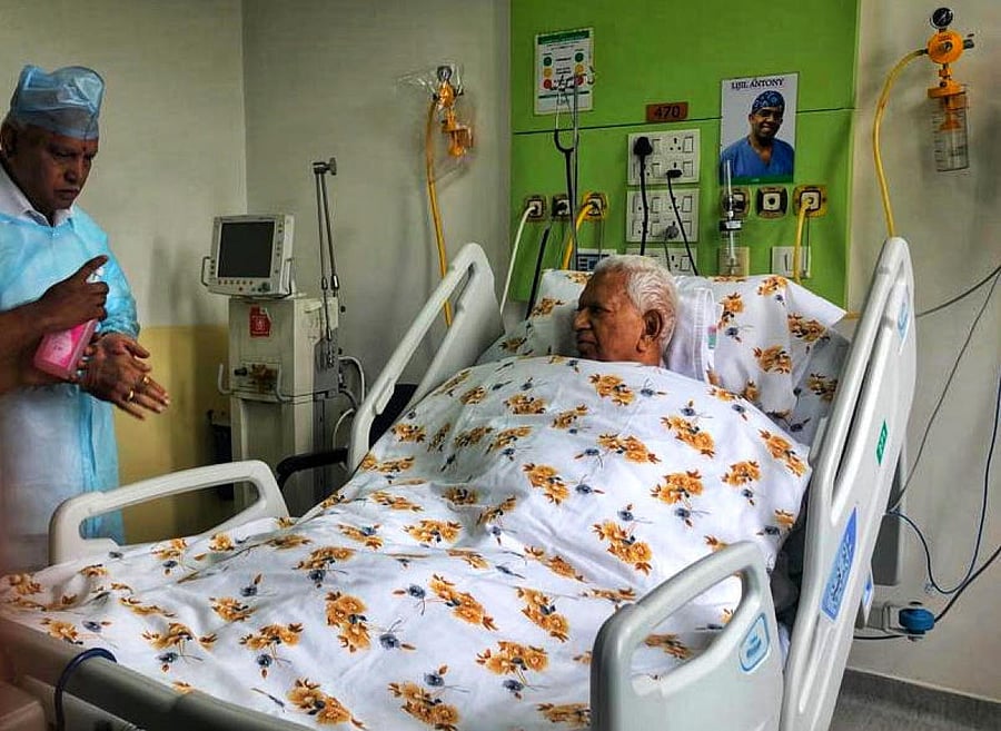 Chief Minister Yediyurappa sanitising his hands while visiting Governor Vajubhai Vala at a hospital on Wednesday.