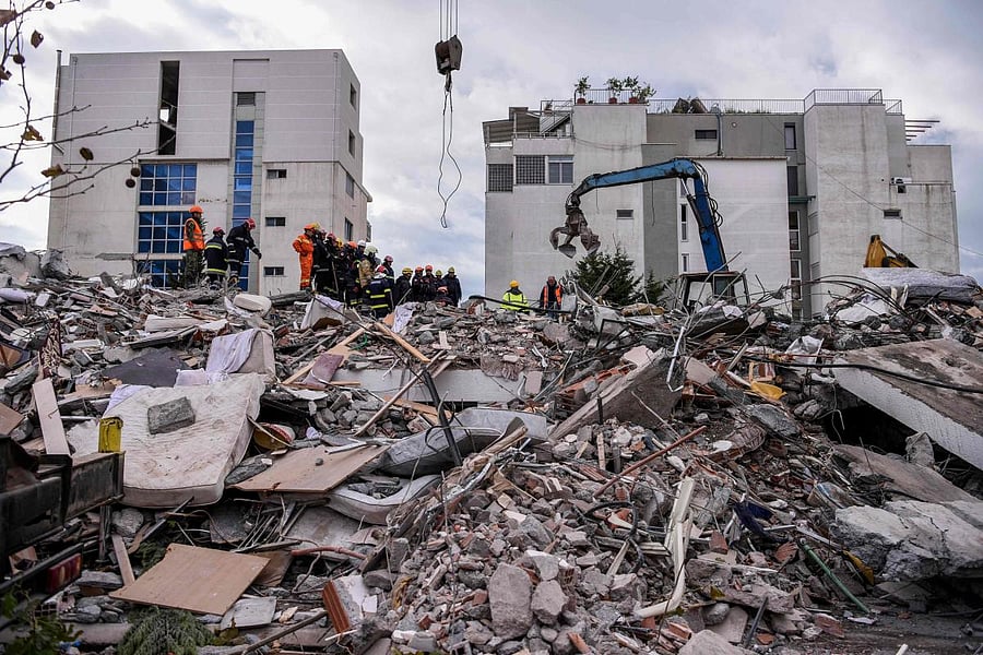 Albanian rescuers dug through rubble as desperate survivors trapped in toppled buildings cried out for help. Photo by AFP