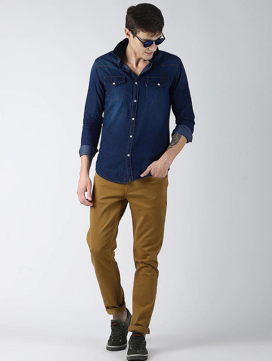 Darkdenim shirtslook goodwith beigepants.