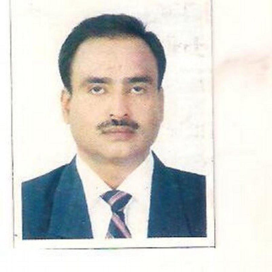 After being led out of the House, Ali lay down on the floor of the entrance lobby of the Assembly holding placards against the Land Policy, 2019. Photo (Twitter/@ahmed_mla