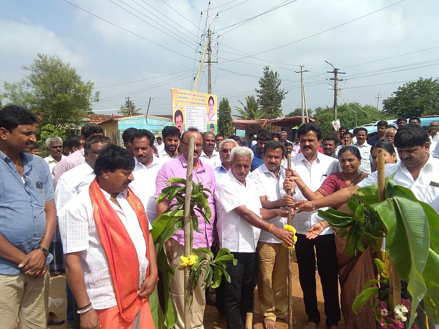 Tarikere MLA D S Suresh initiates work on Amritapura-Kuntinamadu road development in Tarikere on Friday.