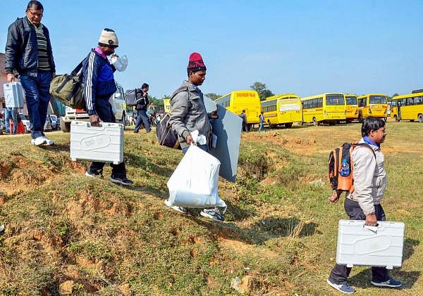 Polling officials carry EVM machines and other polling materials on the eve of the second phase of Jharkhand Assembly election, at Tamar constituency under Bundu Sub-Division near Ranchi, Friday, Dec. 6, 2019. (PTI Photo)