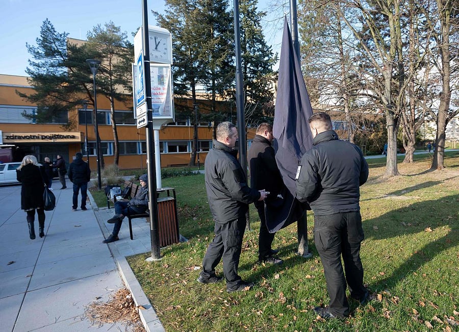 People hang a black mourning flag at a mast in front of the Faculty Hospital in Ostrava, eastern Czech Republic. (AFP file photo)
