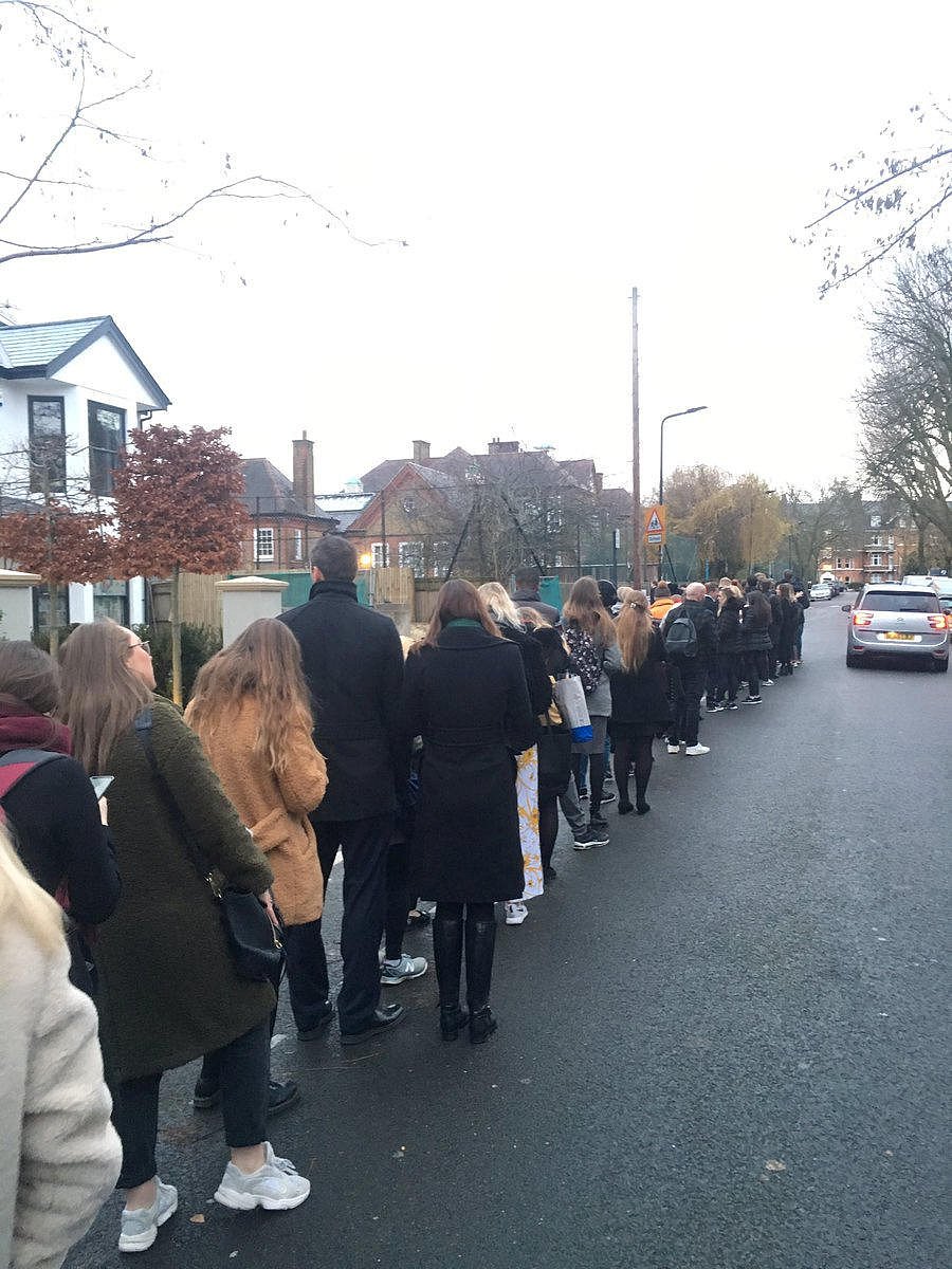 Voters queue outside a polling station during general election, in Clapham, London (Reuters Photo)
