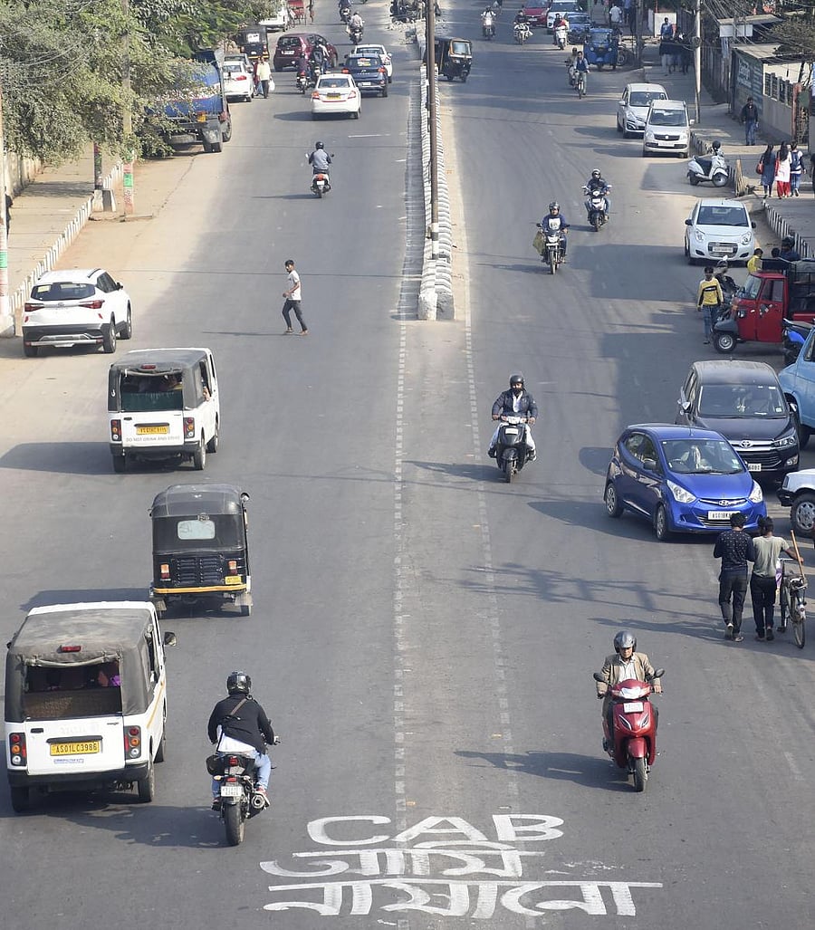 Vehicles play at a road after curfew was relaxed, following anti-Citizenship Amendement Bill (CAB) protests, in Guwahati. (PTI Photo)