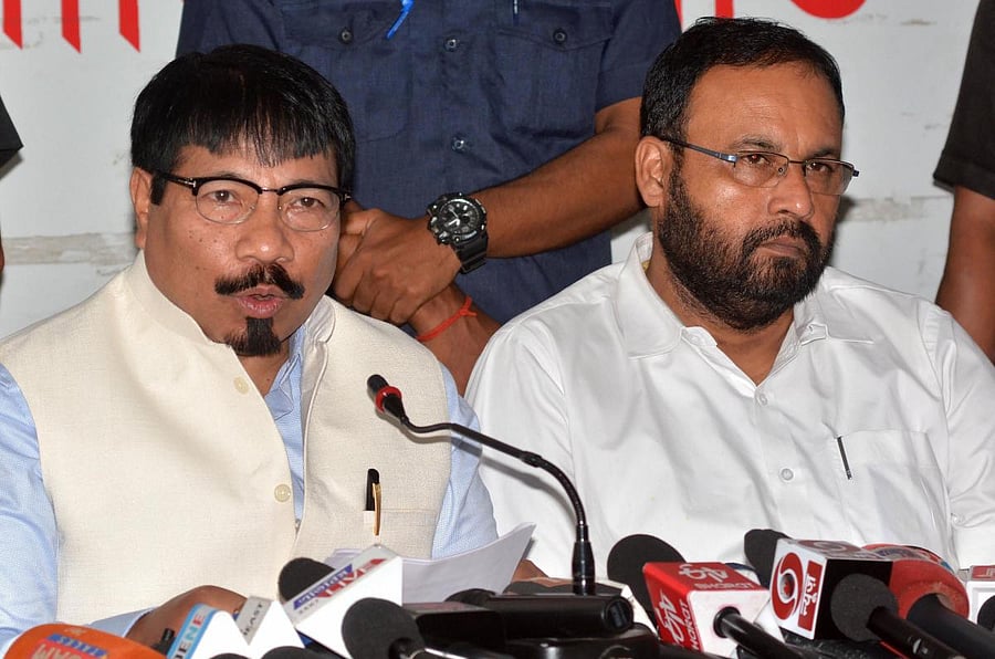 Atul Bora (L). PTI file photo