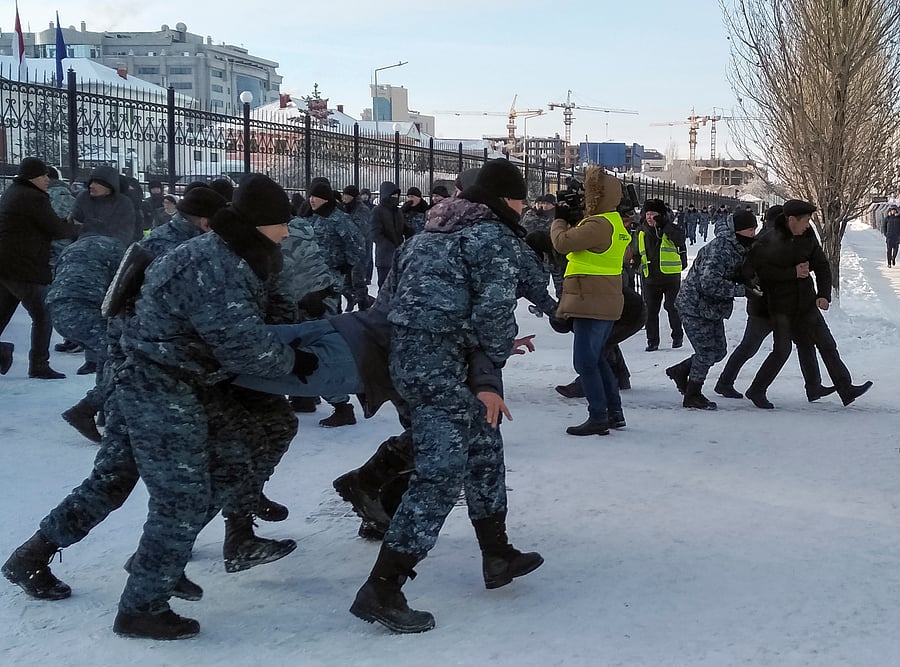 Police officers detain opposition supporters during a rally on Independence Day in Nur-Sultan, Kazakhstan. (Reuters Photo)