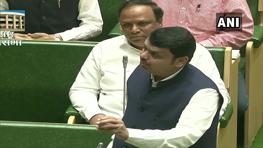 The BJP MLAs marched to the Assembly in the morning with flex boards carrying a report published earlier in the Shiv Sena mouthpiece 'Saamana', demanding Rs 25,000 per hectare assistance for farmers hit by unseasonal rains. Photo/ANI