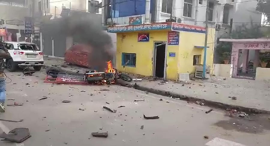 Police outpost set ablaze during protest (DH Photo)