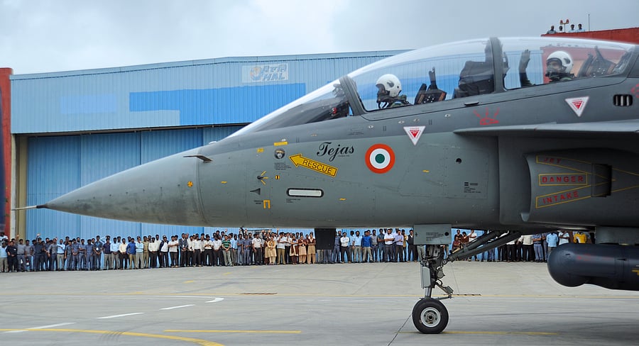 Defence Minister Rajnath Singh prepares to fly in the Tejas fighter aircraft from the HAL airport in Bengaluru. (DH Photo)