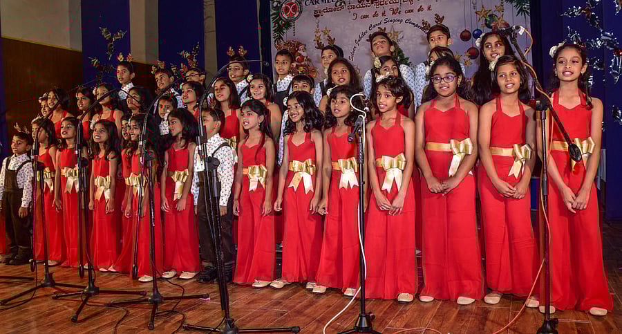Children take part in carol-singing competition in Mysuru. DH photos