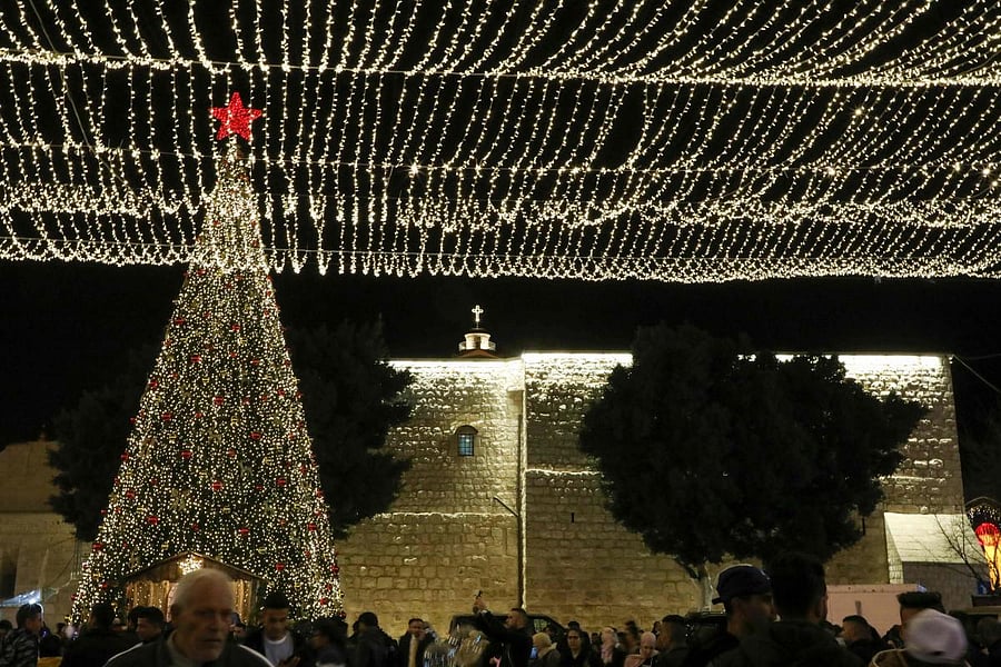 Tourists and pilgrims visit the Manger Square outside the Church of the Nativity in the biblical West Bank city of Bethlehem on December 24, 2019. Photo/AFP