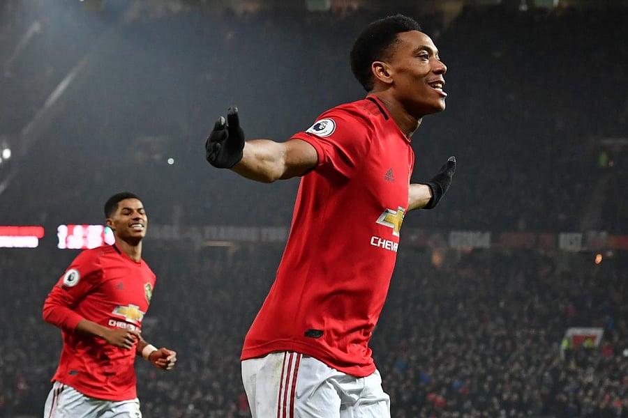 Manchester United's French striker Anthony Martial celebrates after scoring his second goal, the team's fourth during the English Premier League football match between Manchester United and Newcastle United at Old Trafford in Manchester, north west England. (AFP photo)