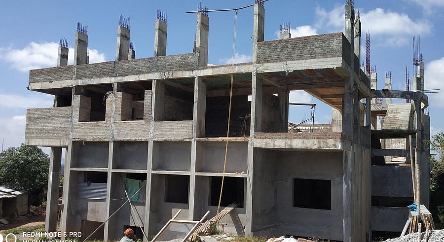 The incomplete work on Kannada Samucchaya Bhavana at Sudarshana Circle in Madikeri. DH Photos.