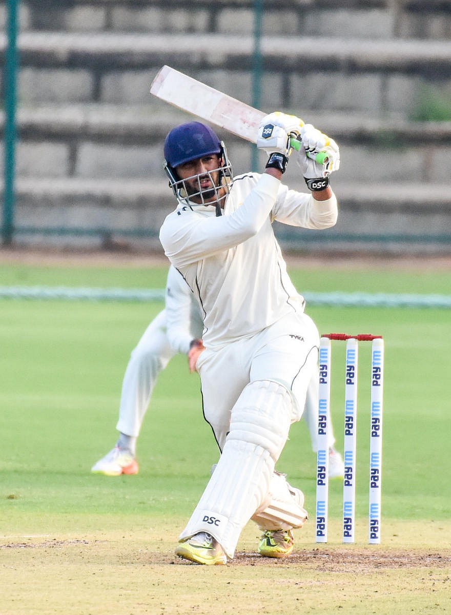 Rishi Dhawan of Himachal Pradesh slams one to the fence during his unbeaten 72 against Karnataka in Mysuru on Thursday. DH Photo/ B R Savitha