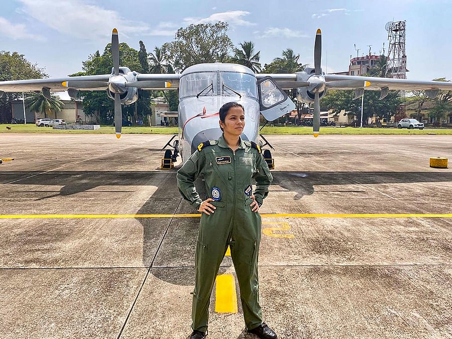 Sub-lieutenant Shivangi stands infront of the Dornier surveillance aircraft. (PTI Photo)