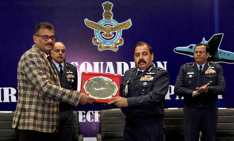 Sajal Prakash, CEO, Accessories Complex HAL, presents a memento to Air Chief Marshal RKS Bhadauria during the induction ceremony of Flight Information System (FIS) Dornier aircraft into No. 41 Squadron at Air Force Station Palam, New Delhi, Tuesday, Dec. 31, 2019. (PTI Photo)