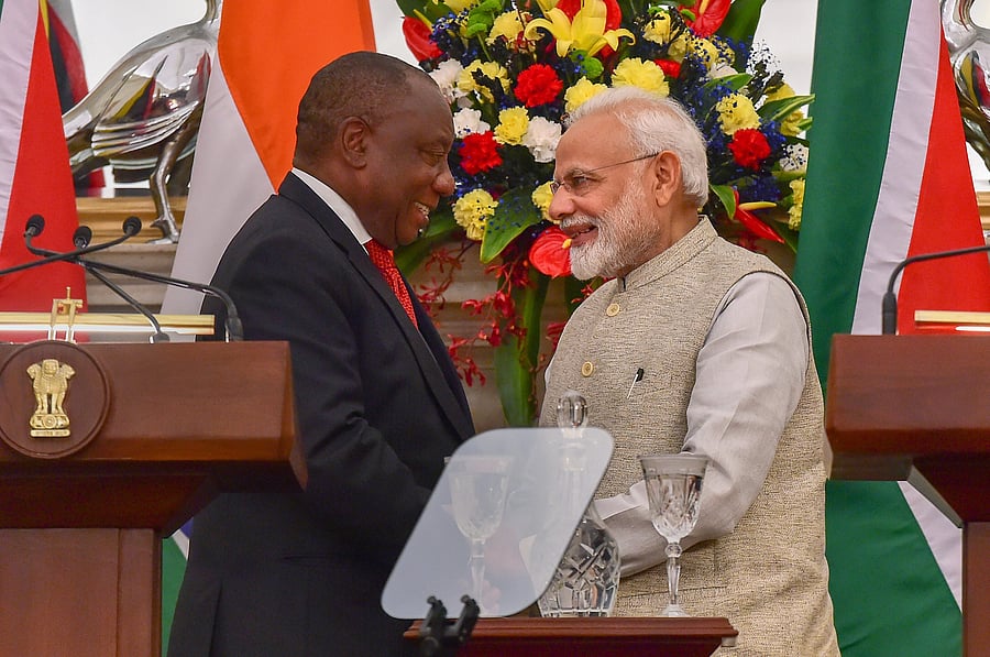 Prime Minister Narendra Modi and South African President Cyril Ramaphosa exchange greetings during the joint statement following a meeting at Hyderabad House, in New Delhi. (PTI Photo)