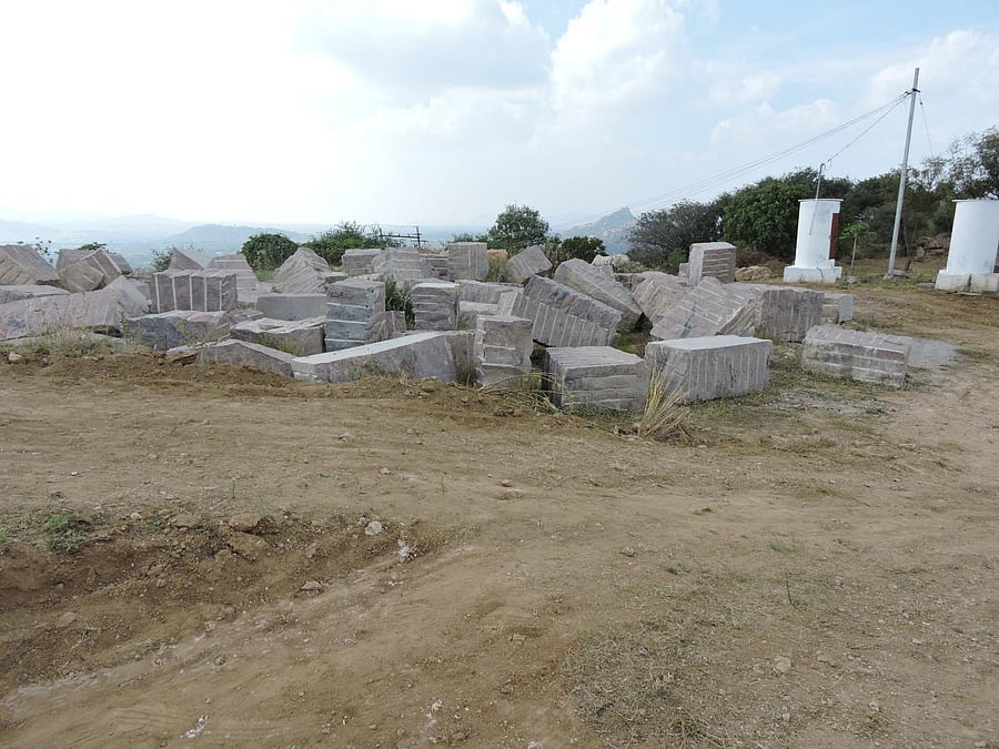 Stones stocked for sculpting Jesus statue atop Kapala Betta in Kanakapura taluk. DH File Photo