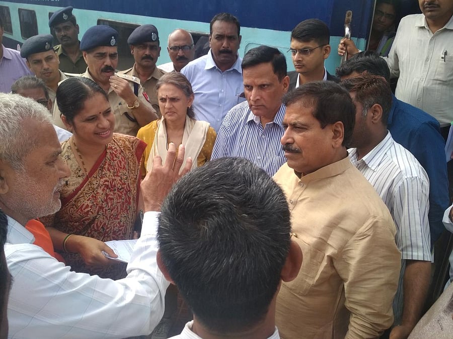 Minister of State for Railways Suresh Angadi meets the public during his visit to Birur Railway Station.