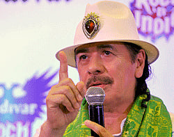 US musician Carlos Santana speaks during a press conference held in Bangalore on October 25, 2012. The 10-time Grammy award winner will be performing in the city on October 26. AFP
