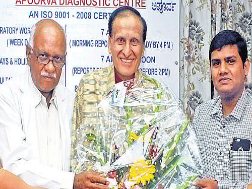 Colleagues Sushilamma, S Jagadish, Kabir Das and Kanchana congratulate Dr Gyan Kej (centre) in the City on Monday on his son Ricky Kej winning the Grammy. DH photo