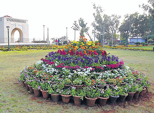 An enchanting view of Raja Seat in Madikeri. (Inset) Deputy Commissioner Anurag Tiwari.