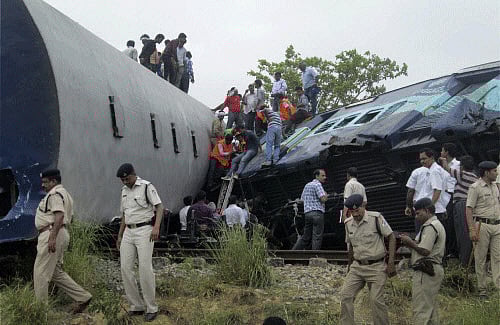 Rescue work in progress after Gorakhpur-bound Gorakhdham Express rammed into a goods train at Chureb station in Basti on Monday. AP photo