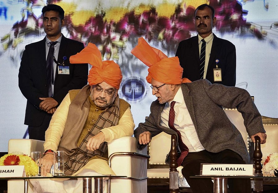  Union Home Minister Amit Shah talks with Delhi Lt. Governor Anil Baijal during inauguration of a 'Cycle Walk', in New Delhi. PTI