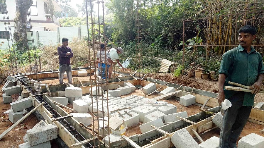 The work on Coorg Village in progress near Raja Seat in Madikeri. DH Photo
