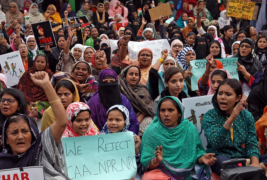 Demonstrators shout slogans as they attend a sit-in protest against a new citizenship law, at Park Circus Maidan in Kolkata. (Reuters Photo)