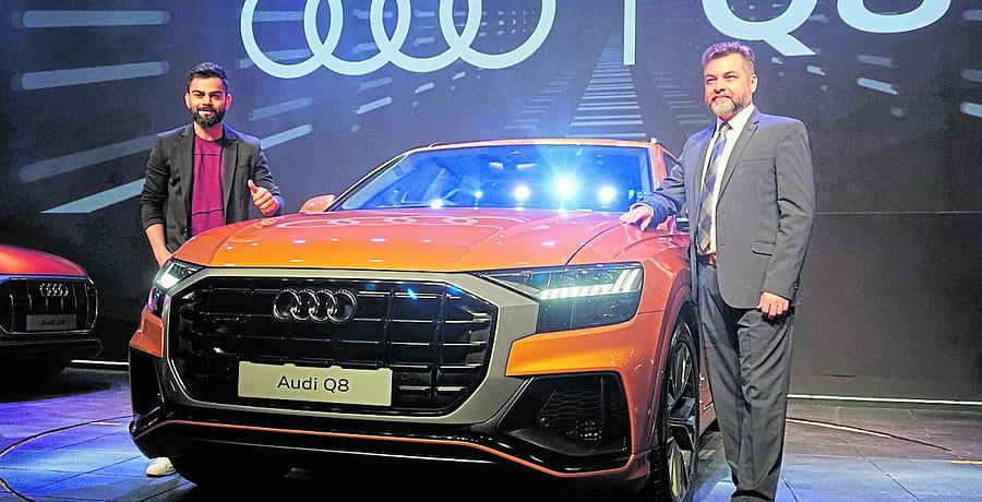 Audi India Head Balbir Singh Dhillon with cricket star Virat Kohli during the Q8 launch in Mumbai. (DH Photo)