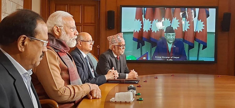 Prime Minister Narendra Modi (2nd L) and his Nepalese counterpart KP Sharma Oli (on the screen) jointly inaugurate the second Integrated Check Post (ICP) at Jogbani-Biratnagar, built with Indian assistance to facilitate trade and people's movement, via vi