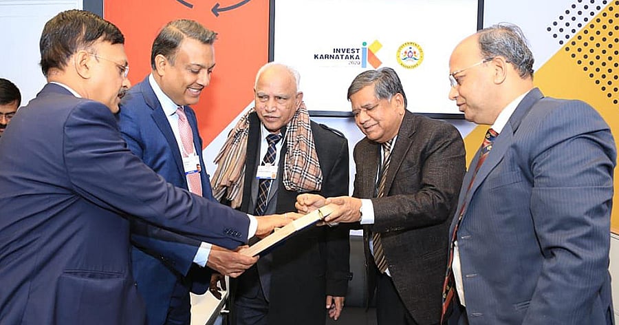 Chief minister B S Yediyurappa with CEO of Renew Power Limited Samanth Sinha at the Karnataka Pavillion in Davos. Minister for Industries Jagadish Shettar, Chief Secretary T M Vijaybhaskar and Principal Secretary to Department of Industries and Commerce,