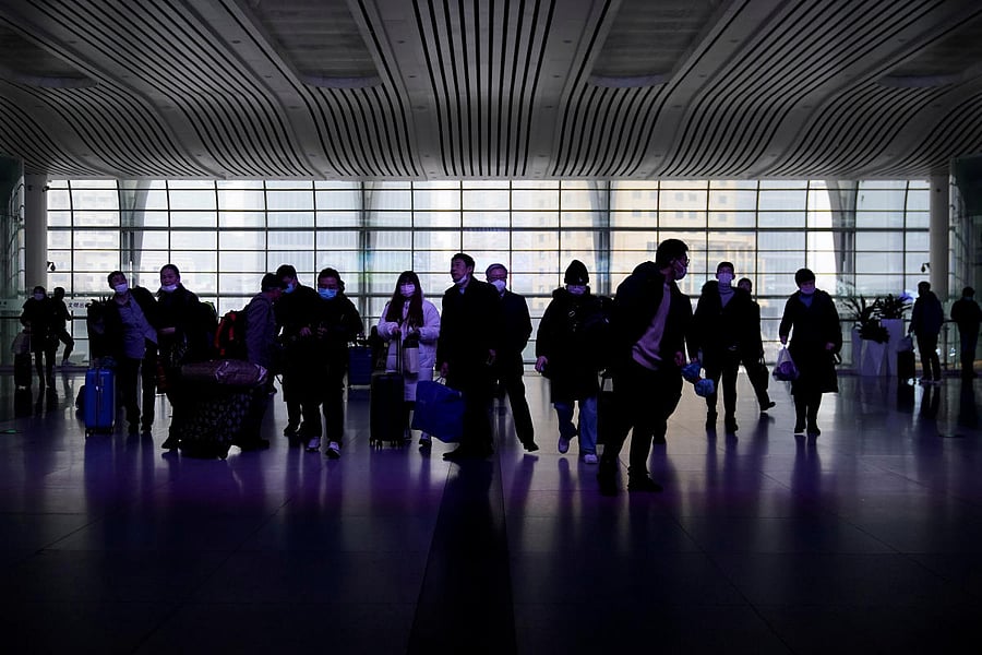 Passengers wearing masks are seen at Shanghai railway station in Shanghai. Reuters photo for representation