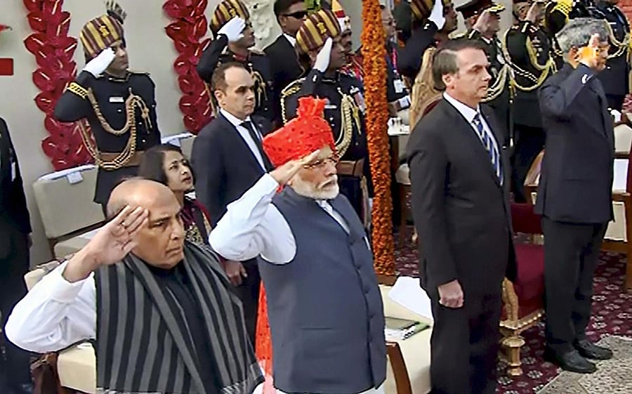 Defence Minister Ram Nath Kovind, Brazilian President Jair Messias Bolsonaro, Prime Minister Narendra Modi and Defence Minister Rajnath Singh stand for the national anthem during the 71st Republic Day celebrations at Rajpath, in New Delhi, Sunday, Jan. 26