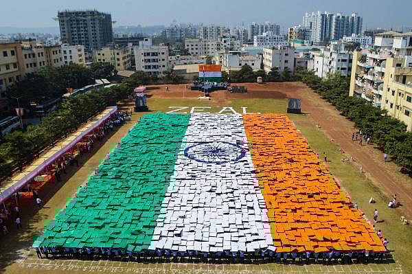  Around 4000 students from Zeal Education Society hold placards to form a huge Indian national flag, in Pune, Maharashtra, Saturday, Jan. 25, 2020. (PTI Photo) 