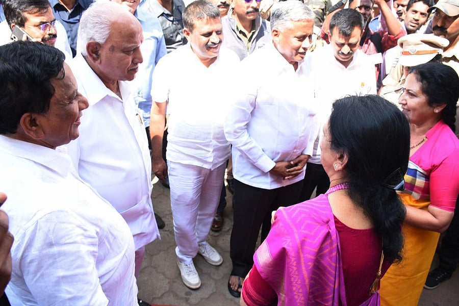 Chief Minister B S Yediyurappa speaks to MLC Veena Acchaiah and expresses his regrets over the violation of protocol during the foundation stone laying programme in the premises of government maternity hospital in Madikeri on Monday. DH Photo