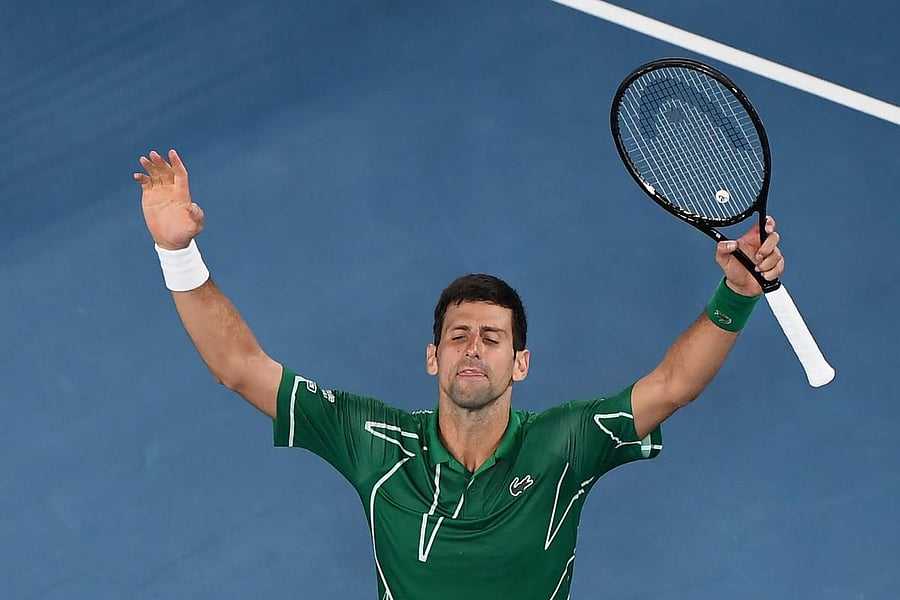Serbia's Novak Djokovic celebrates after beating Switzerland's Roger Federer during their men's singles semi-final match on day eleven of the Australian Open tennis tournament in Melbourne. AFP
